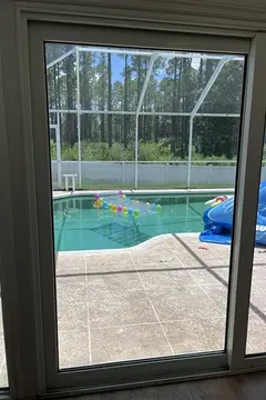 A patio door with double pane glass with no fogging after being repaired by Glass Doctor of Ocala.